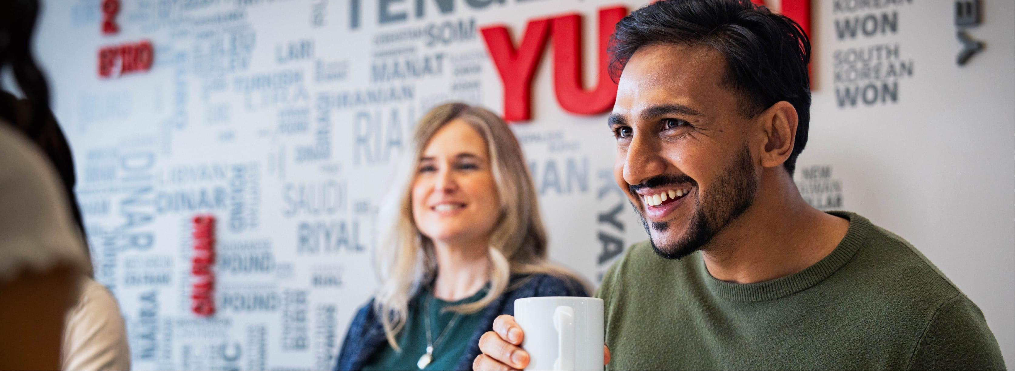 A cropped image of two people in the office. Only the eyes are visible.